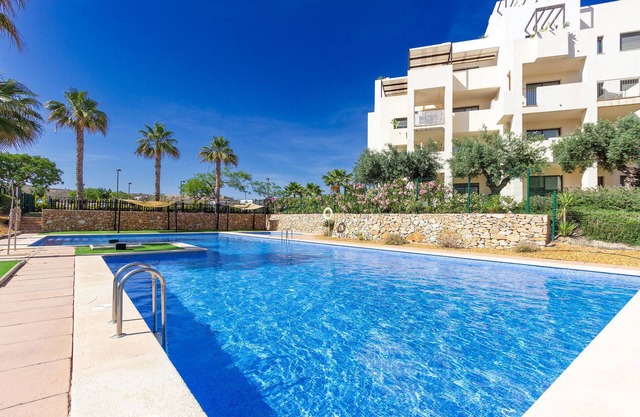 Enjoy peace and relaxation at this golf country club with communal pool.