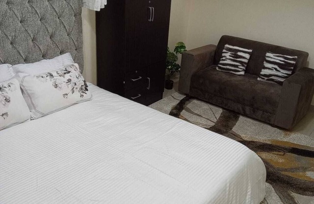 Escape to comfortn 2-bedroom apartment with WiFi, AC in fabulous Abu Dhabi