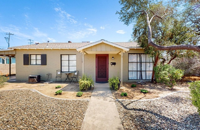 Escape to this charming house in Phoenix, AZ w/large yard & close to hiking