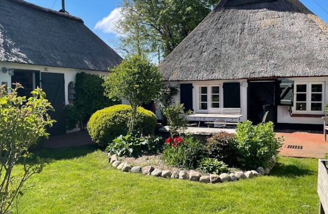 Frisian cottage on the sea dike