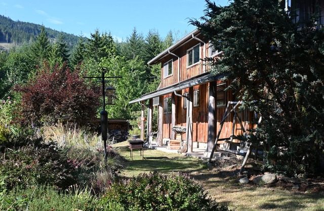 Gorgeous log cabin homestead amidst gardens just west of Port Angeles