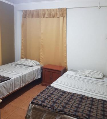 Habitación con doble cama privada en Talara centro