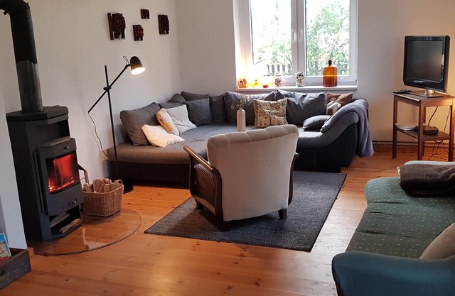 Holiday house with a large garden and swimming lake in the village