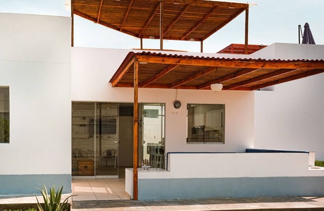 House next to the beach in a condominium.