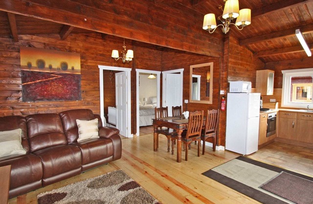Lake side log cabin peacefully situated and each enjoying fabulous lake views.