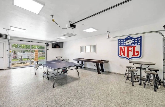 Lambeau Views + Tailgate Ready! Stay just steps from Lambeau Field with space for up to 12 guests! Enjoy a game-filled garage, hot tub, and backyard views of the stadium. Perfect for Packers games, weddings, family gatherings and group getaways.