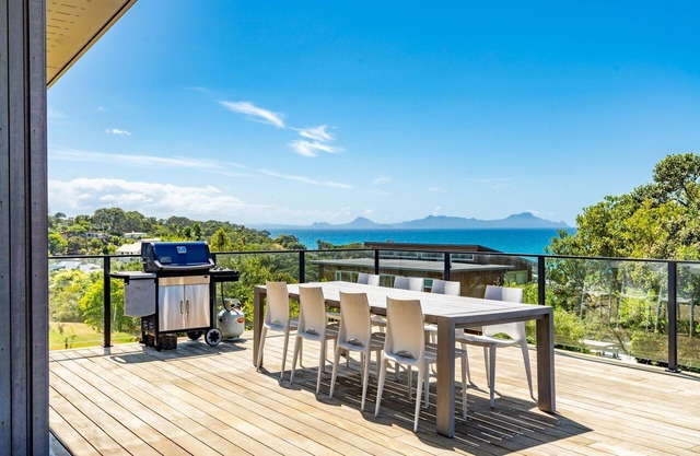 Langs Beach House - Modern, sunny holiday home with large decks and stunning views over Bream Bay