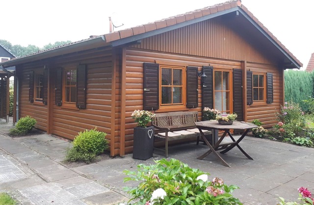 Log house pearl in the green