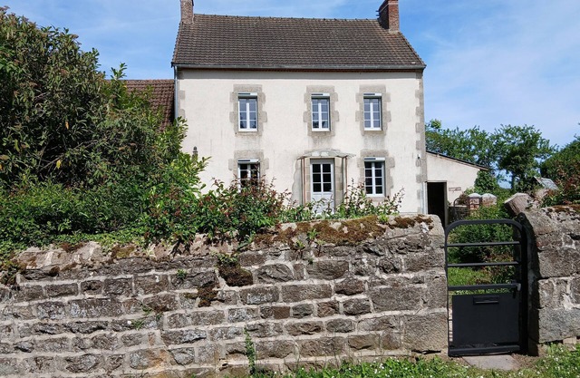 Lovely detached house close to village on enclosed land planted with trees.