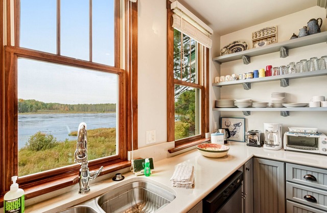 Lovingly restored, historic home on 160 acres w/game room & dock