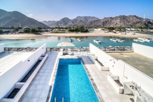 Luxurious 4-Bedroom Villa with Assistant Room and Private Pool in Al Dana Island, Fujairah by Deluxe Holiday Homes