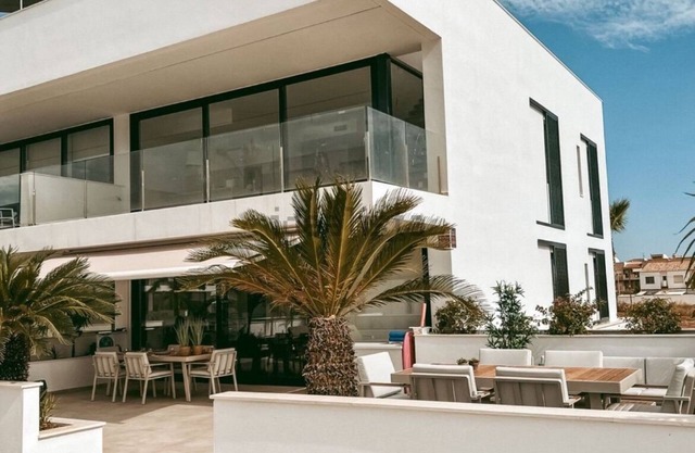 Luxurious apartment with large sunny terrace within walking distance to the sea and stores.