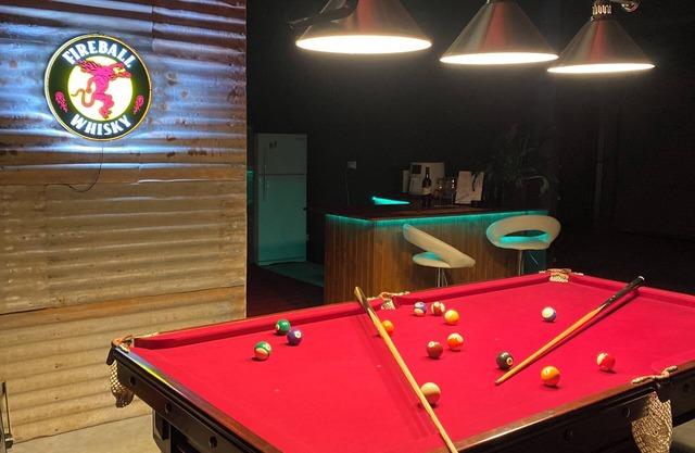 Man Cave with a touch of Lux. and an open fire.