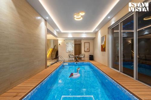 Mocha House with Indoor Pool, BBQ & Bonfire at Lonavala by StayVista