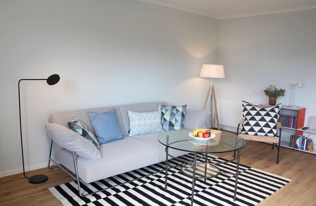 Modern flat facing south with view over mountains and lake