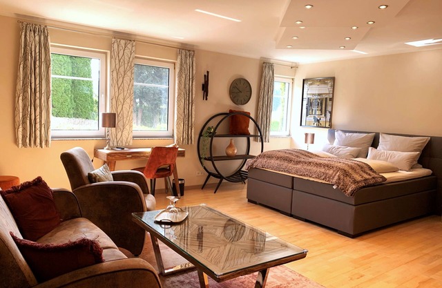 Modern junior suite with kitchen and garden terrace