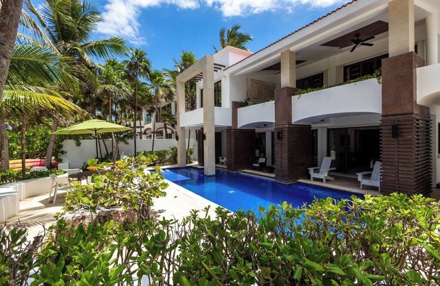 Modern upscale beachfront villa, perfect for a wedding, reunion or more!