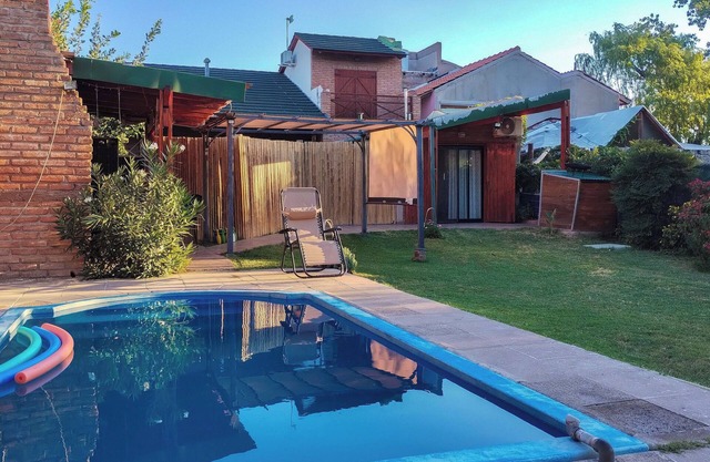 Nancy and Carlos's house, view of the mountains, swimming pool and barbecue area.