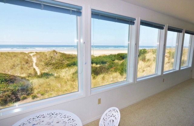 New Listing! Cozy beachfront getaway with amazing views and miles of sandy beaches