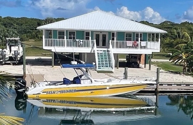 NEW RENTAL! Conch Heaven is a four bedroom house on a canal with a dock.