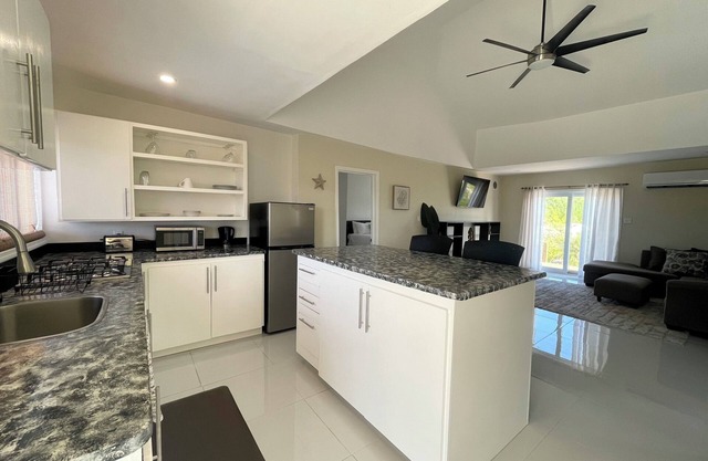 Newly Built 2-Bedroom Villa Short Walk From Beach & Minutes away from Airport!