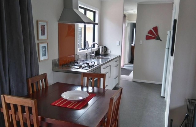 Now with unlimited fibre broadband! Warm,2 bedroom bach in quiet,sunny location.