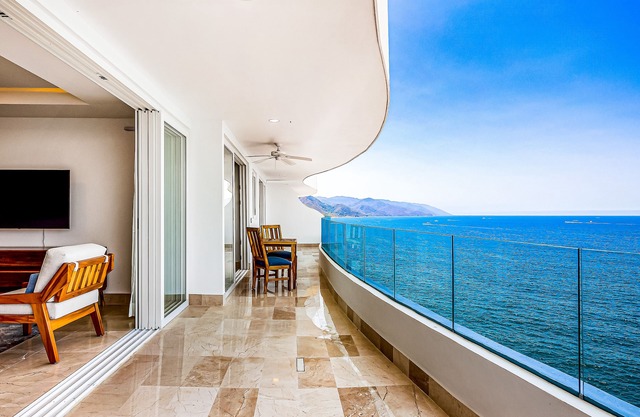 Oceanfront 9th-floor condo with balcony, water views & pool