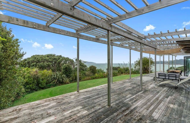 Oceanview Sanctuary - Modern, sunny holiday home with extensive decks and stunning views over Bream Bay