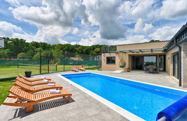 On the outskirts of Koprivnica is this modern vacation home with swimming pool and indoor spa area.