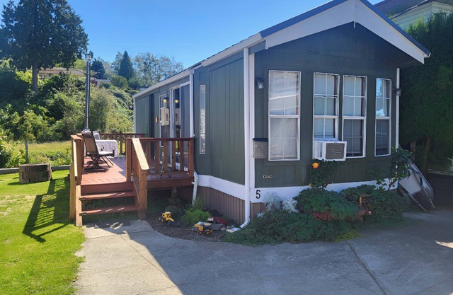 Park Model by creek and across street from beach.