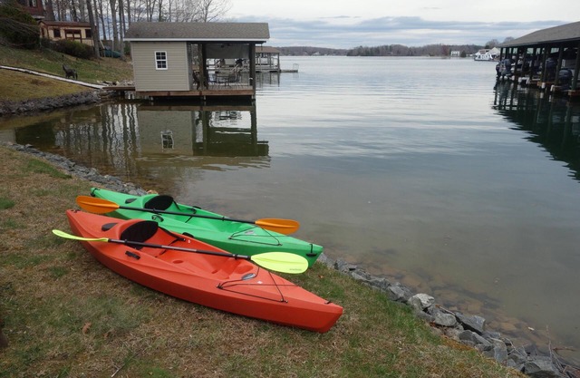 Power down as hot tub, kayaks, and pool table await, water "footsteps away".