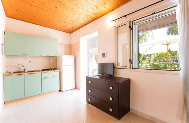 Property in a Holiday Village 'Baia Falcone - Comfort 210' with Sea View and Air Conditioning