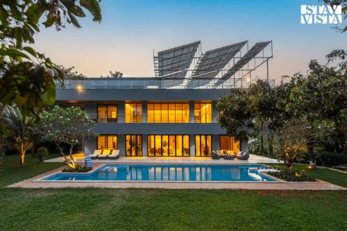 Reflection House by StayVista with Pool, Terrace bar, Indoor games & Exquisite interiors in a nutshell