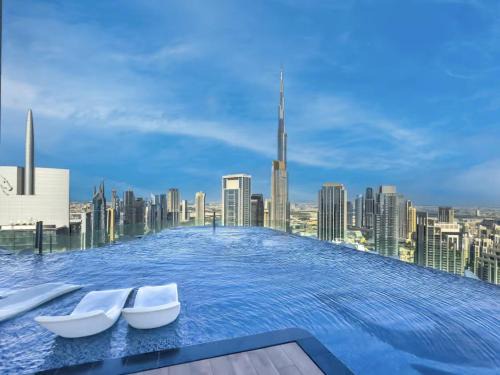 Restay Homes at Paramount Midtown Hotel - Highest infinity pool access with Burj View