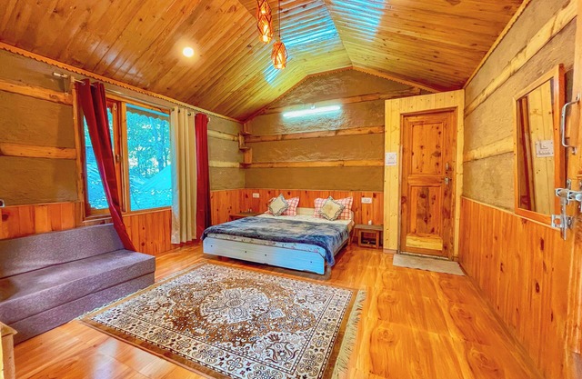 Riverside wooden cottages with a great valley-scape