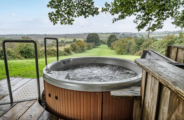 Romantic woodland cabin with private hot tub and moorland views