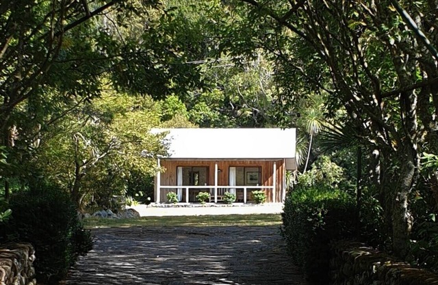 Rustic cabin & large kitchen block nestled in a native garden.