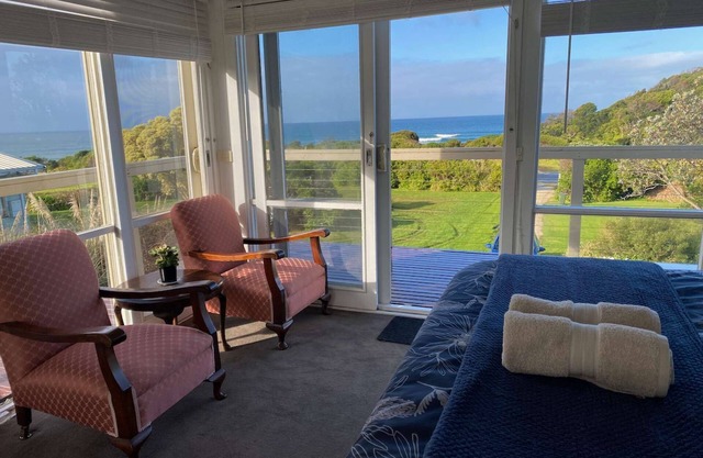 Self-Contained Double Storey Beach House Across the Road from the Beach with Incredible Ocean Views.