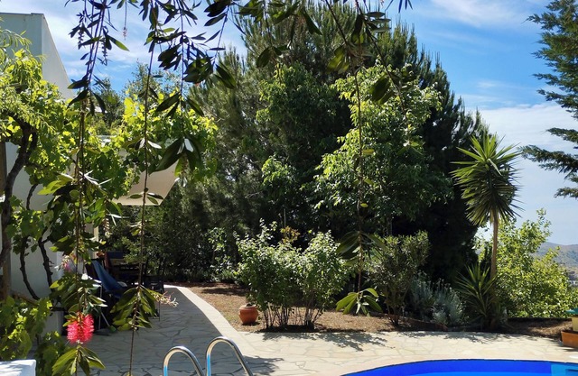 Sheltered house in the mountains with sea views and private pool.