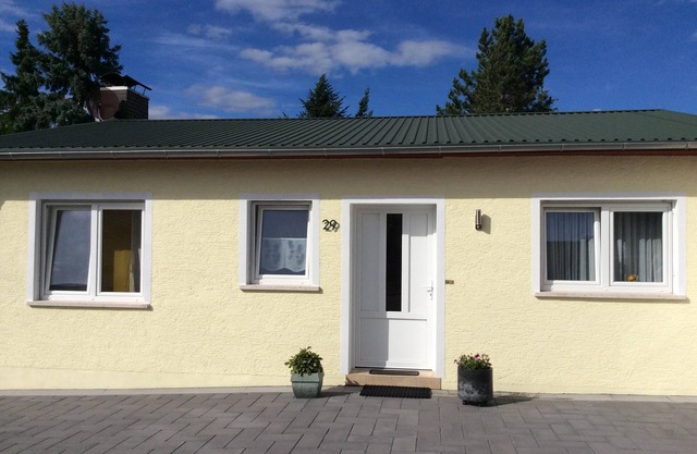 Small country house with terrace and garden on the edge of the forest