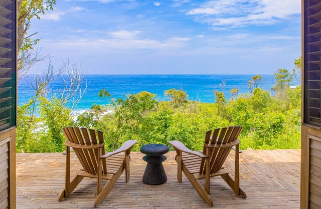 Spacious beachside home with pool, tropical garden, and oceanview lounging