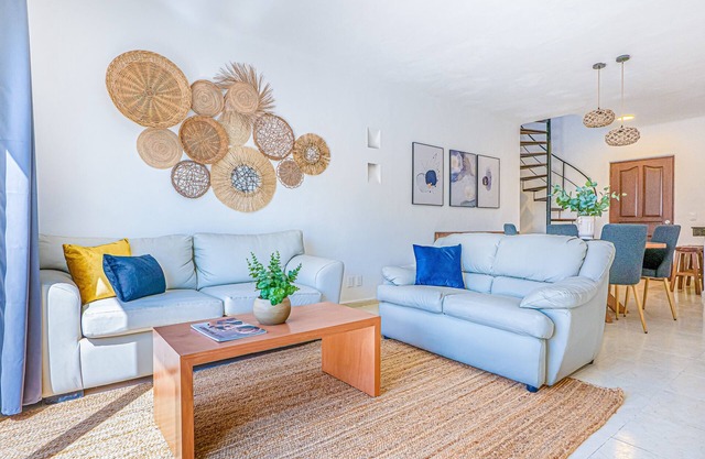 Spacious modern apartment with private balcony, pool access & steps to the beach