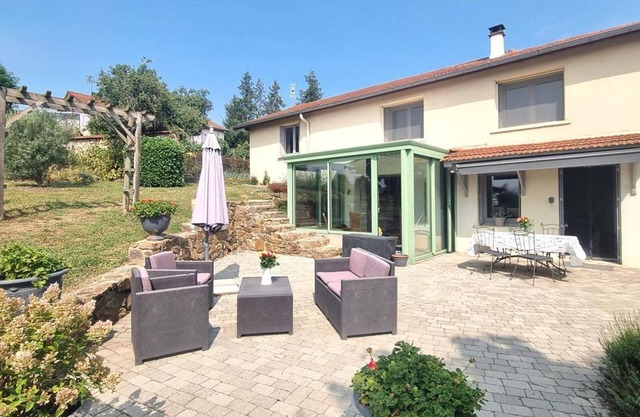 Spacious renovated cottage with bright veranda and outdoor games in Saint-Galmier