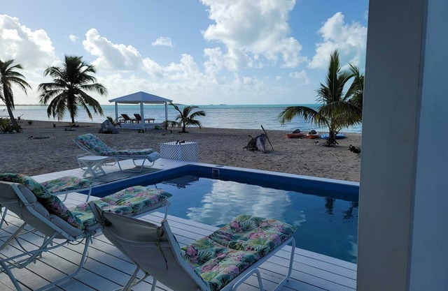 Spectacular beachfront calm water sunset property