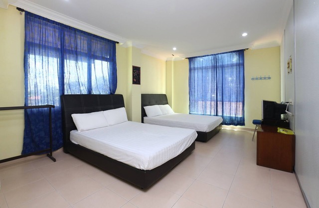 SPOT ON 89857 Azra Inn Rumah Tumpangan