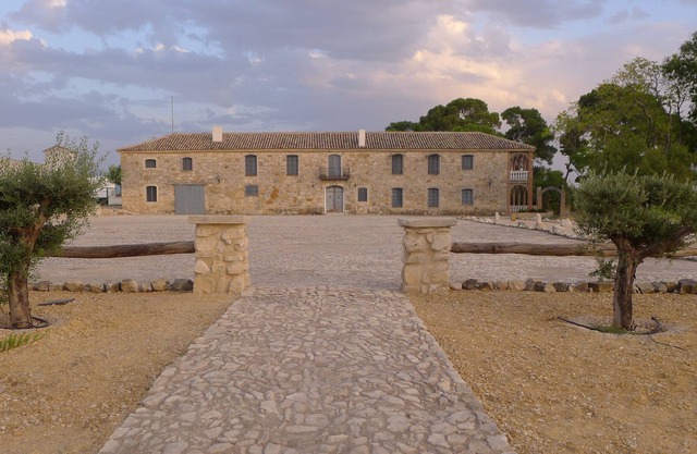 Stately farmhouse in the heart of the Andalusian olive grove.