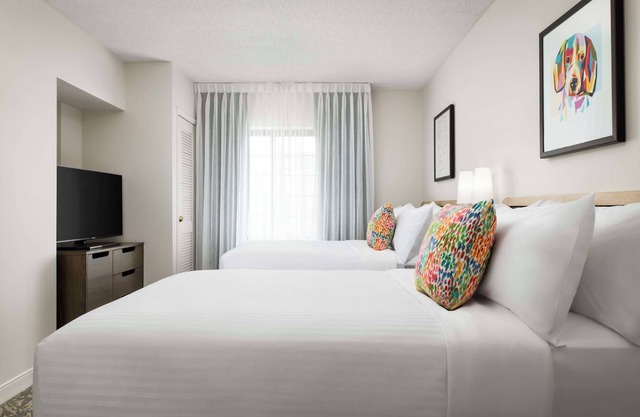 Stay Comfortably in a Pet-Friendly Suite with Swimming Pool Near Attractions