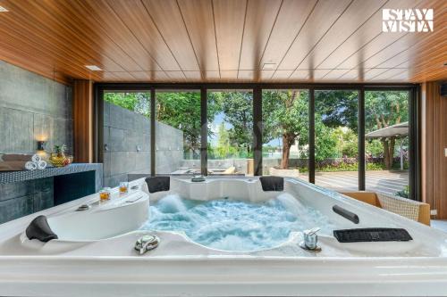 StayVista at Enclave of Bliss with Jacuzzi & BBQ Grill