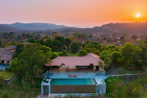 StayVista's Basalt - with Mountain Views, Infinity Pool, Vintage Interiors, and Games Room