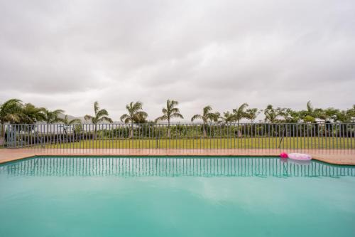 StayVista's Eva Villa - Lakeside Luxury with Modern Decor, Pool & Expansive Lawn - Near Sula